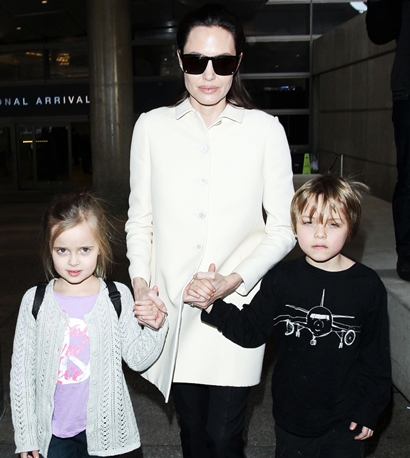 Angelina Jolie and kids arriving at the Los Angeles International Airport
