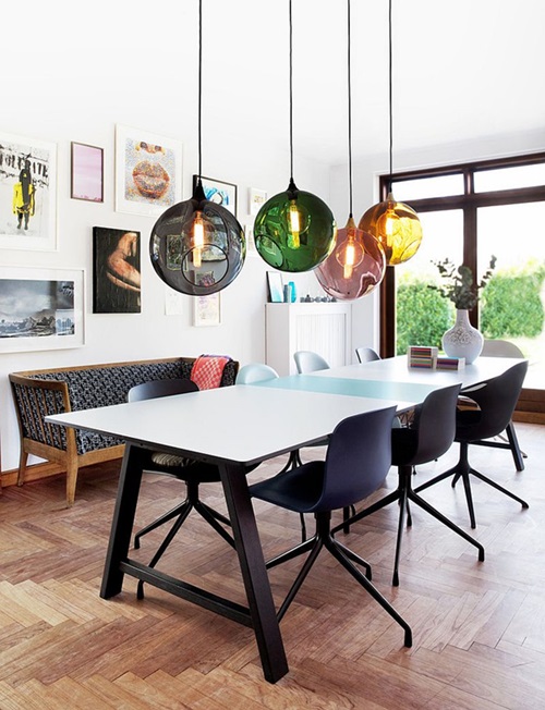 Colorful-orbs-above-the-dining-table-breathe-life-into-the-curated-contemporary-dining-room